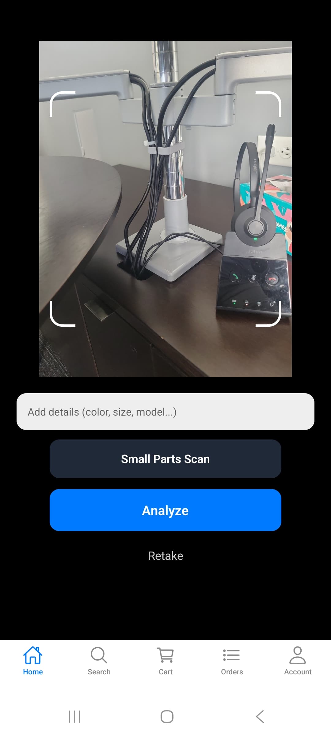 SnapShop AI camera screen with photo of a monitor arm stand, Add Details field, and Analyze button